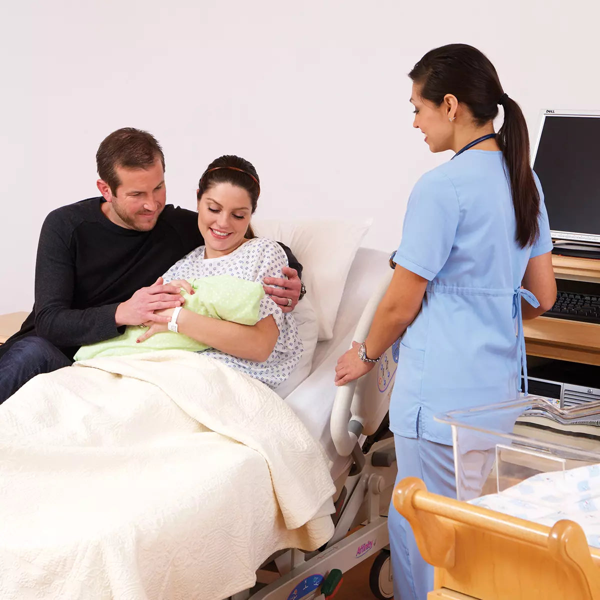 Mother and Infant in Hill-Rom Birthing Bed